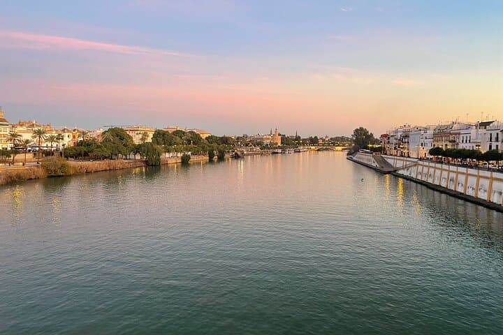 GuadalqEnjoy stunning views of the Guadalquivir River from Triana Bridge during the High Life tour.
uivir River