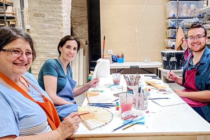 Learn traditional fan-painting techniques from a local artist