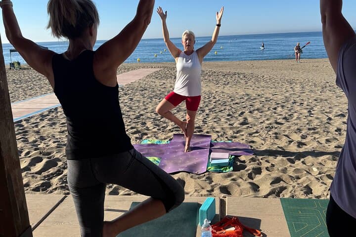 Beach yoga with Pilates elements, beginner-friendly