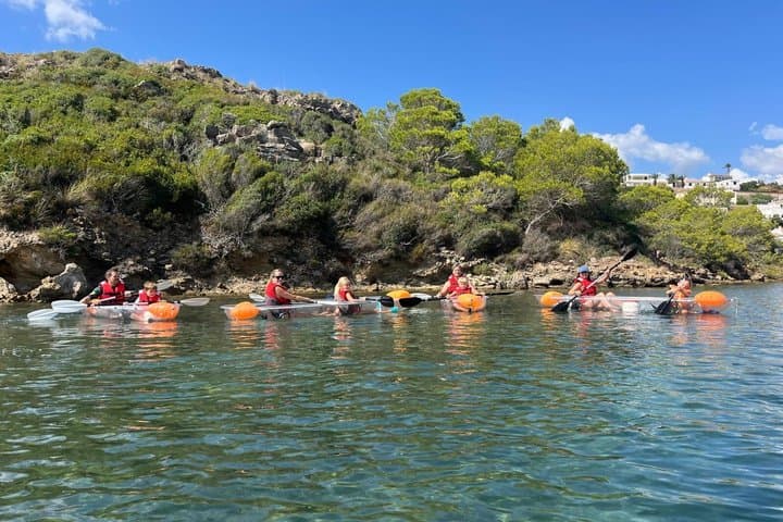 Guided tour in transparent kayaks of Addaia Bay