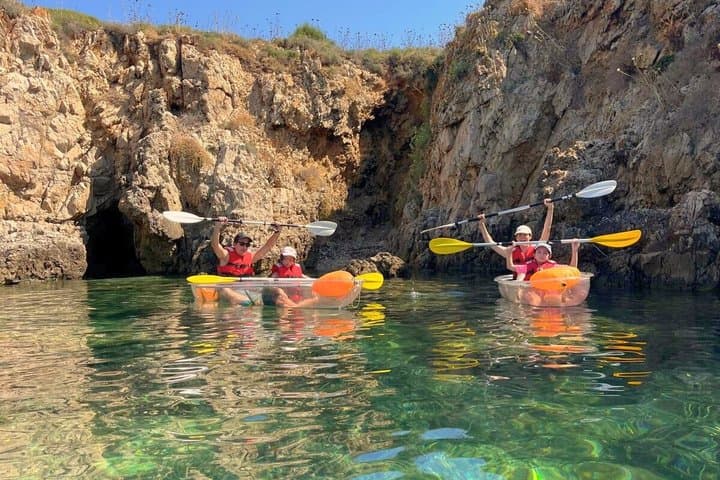 Guided tour in transparent kayaks of Addaia Bay