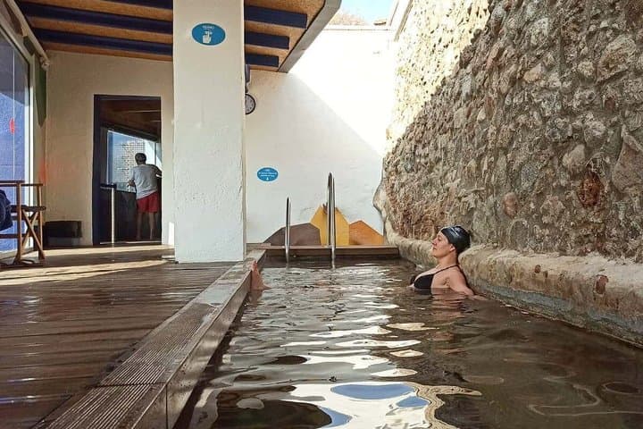 From Barcelona: Thermal Baths & Scenic Mountain Walk