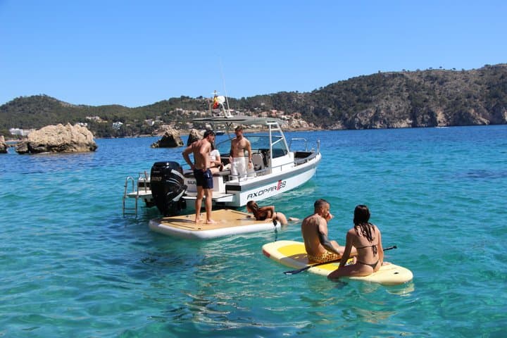 4-hour boat trip with snorkeling and paddle surfing in coves