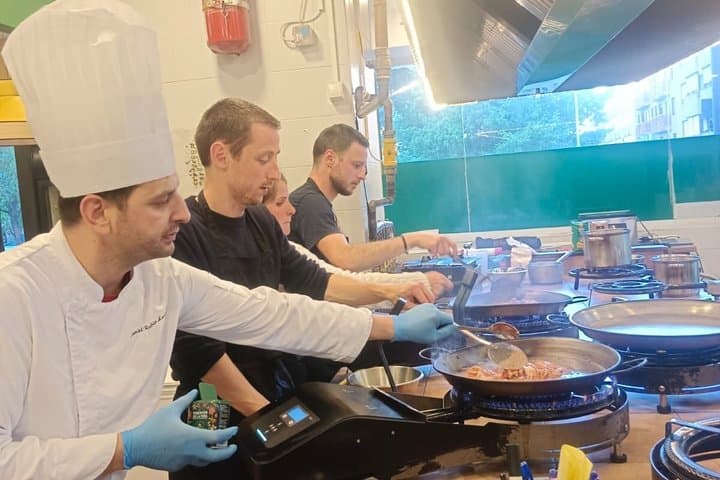 Madrid : Paella and Churros cooking class, ham and wines tasting