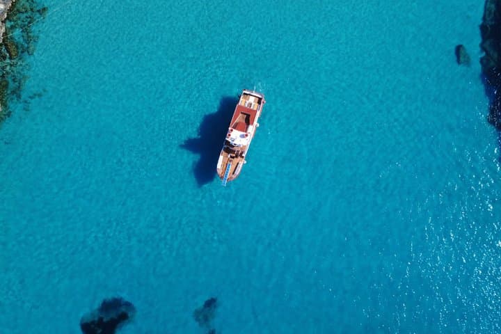 Ibiza Beach Hopper with Lunch Open Bar Paddle Surf and Snorkeling