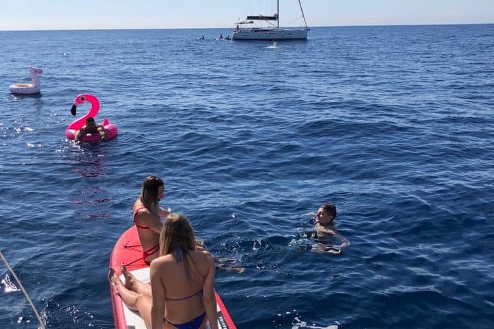 Barcelona Day & Sunset Sailing: Open Bar, Local Tapas & Swim