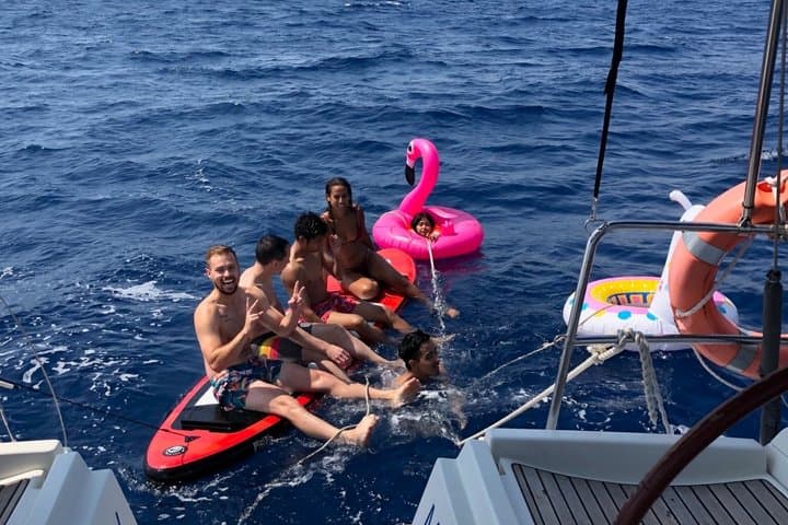 Barcelona Day & Sunset Sailing: Open Bar, Local Tapas & Swim