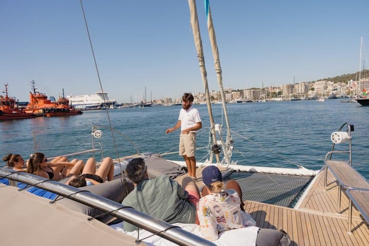 Catamaran sailing in Mallorca through the Bay of Palma with BBQ