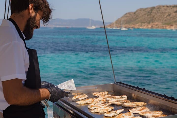 Catamaran sailing in Mallorca through the Bay of Palma with BBQ