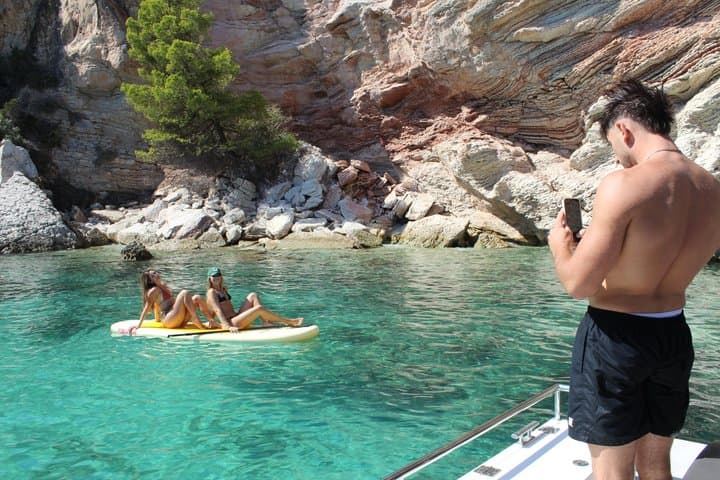 2.5 hour boat trip with snorkeling and paddle surfing in coves