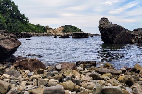 Wild beach of geological formations
