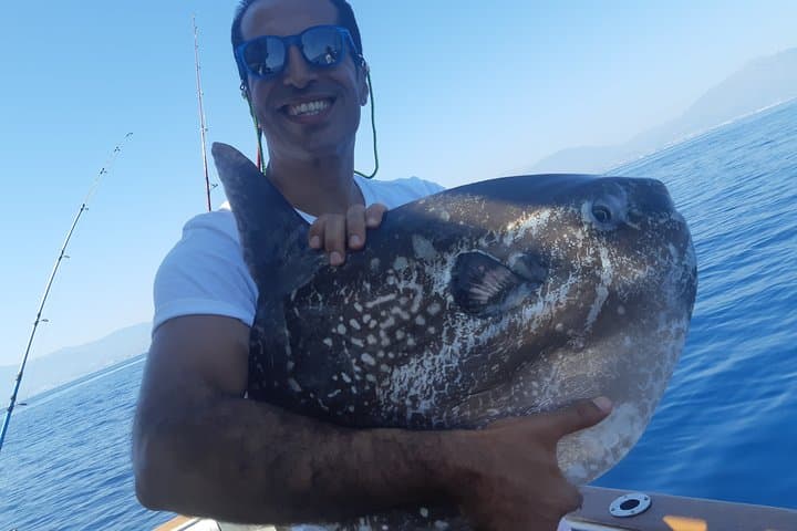 Catch and release this price Moonfish. Boat fishing in Marbella with Lovit Charter