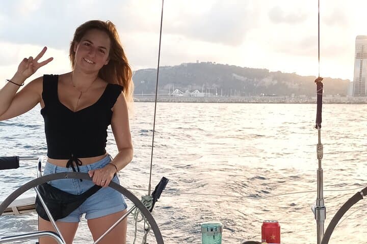 Sunset on a Sailboat along the Coast of Barcelona