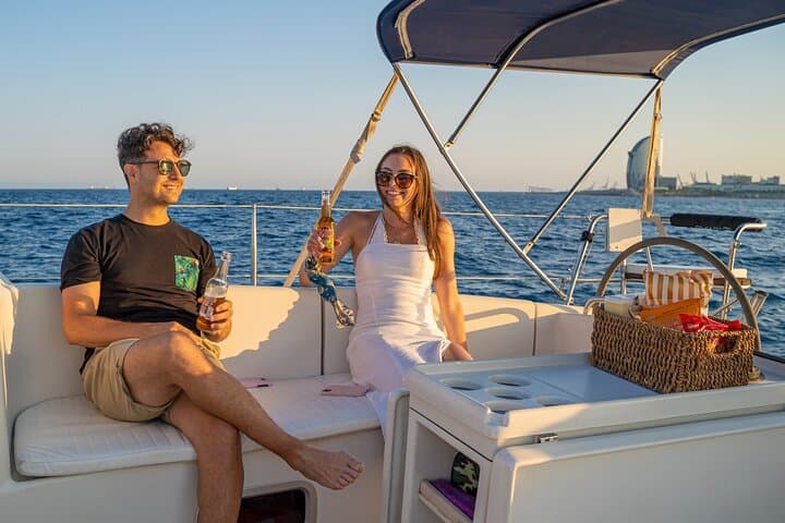 Sunset on a Sailboat along the Coast of Barcelona