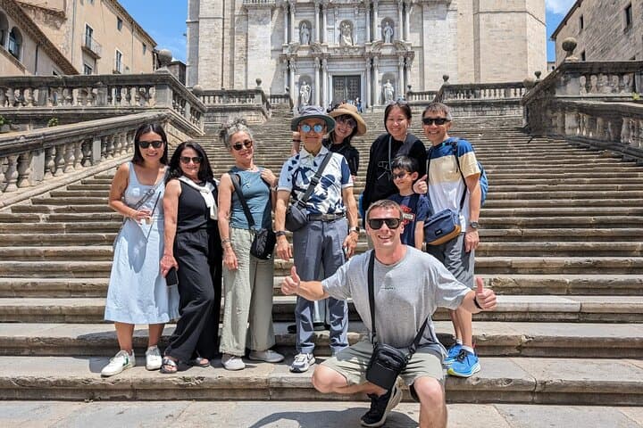 Guided tour group at Girona Cathedral with a local guide.