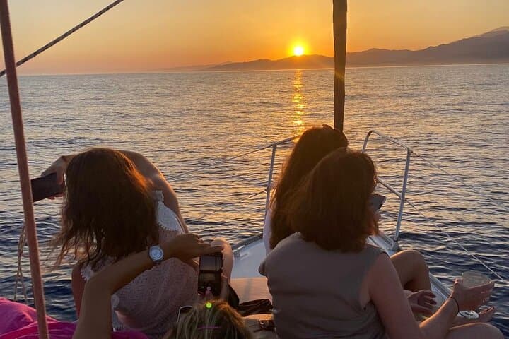 Sailing at sunset along the cliffs of Maro-Compartida