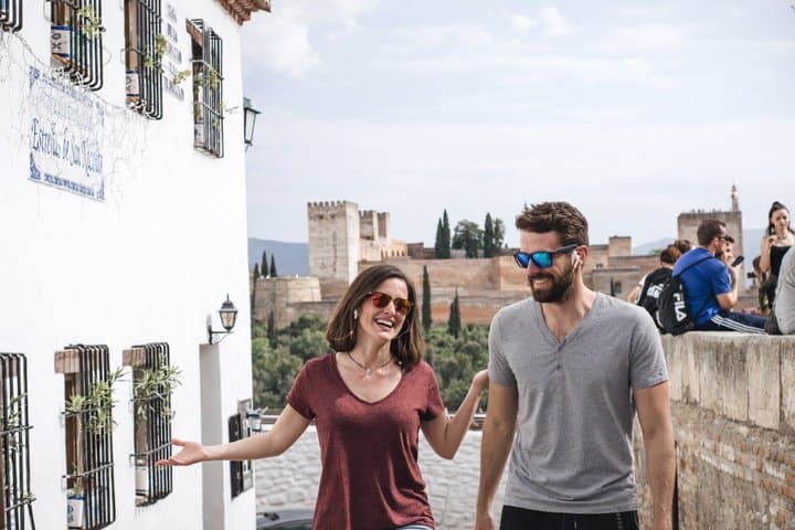 The iconic Alhambra from the Albaicín viewpoint. Our audio tour guides you through 26 captivating stops in Granada's most atmospheric neighborhoods, including stunning Alhambra panoramas.